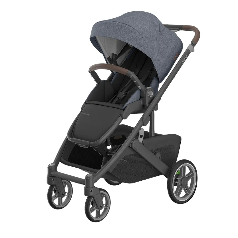 UPPABABY Cruz V3 stroller in blue denim fabric with brown leatherette handle and large canopy