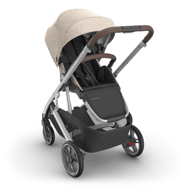 Uppababy Cruz V3 stroller with beige canopy, black seat, gray frame.