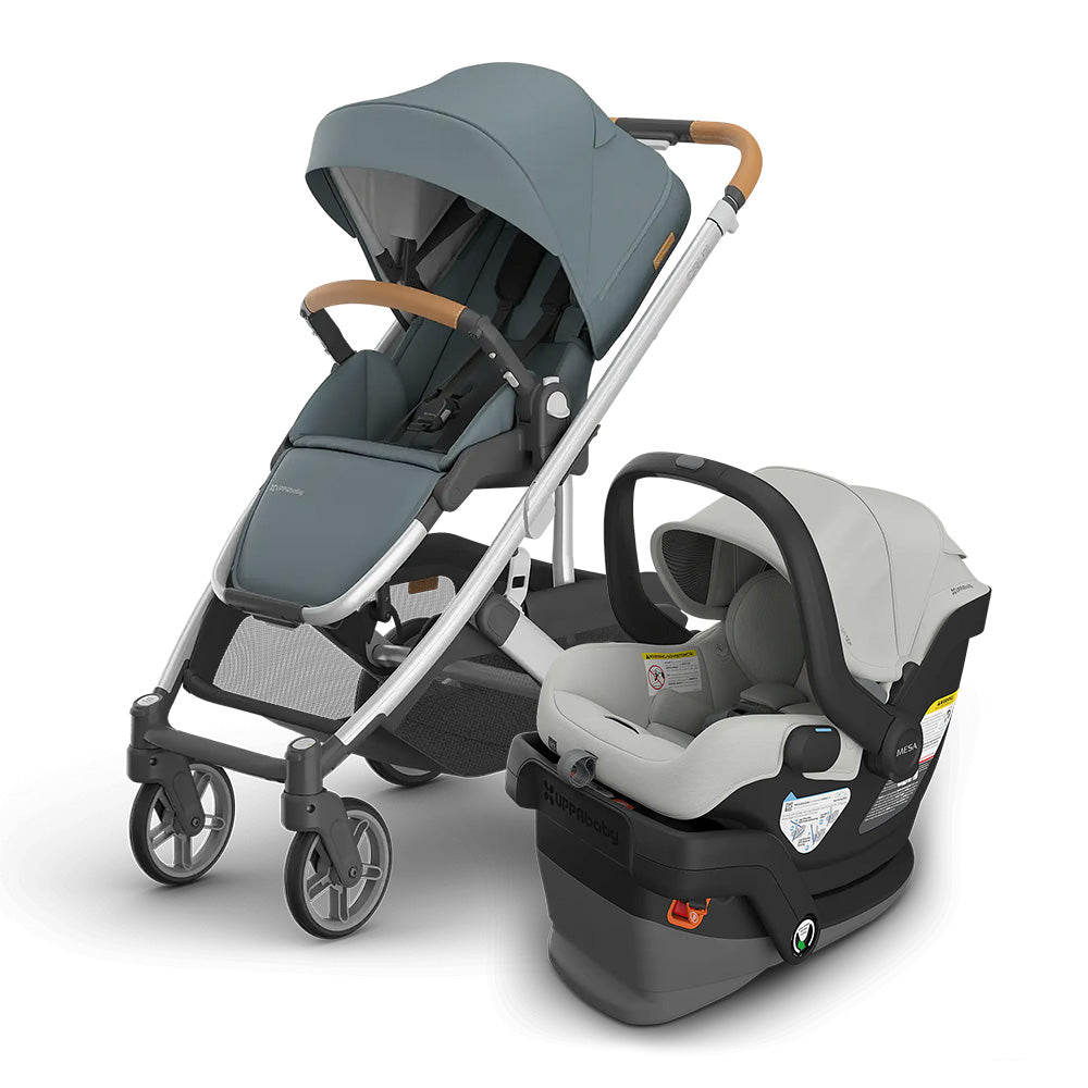 UPPABABY Cruz V3 Stroller + Mesa V3 Infant Car Seat Travel System in blue-gray with canopy and attached car seat.
