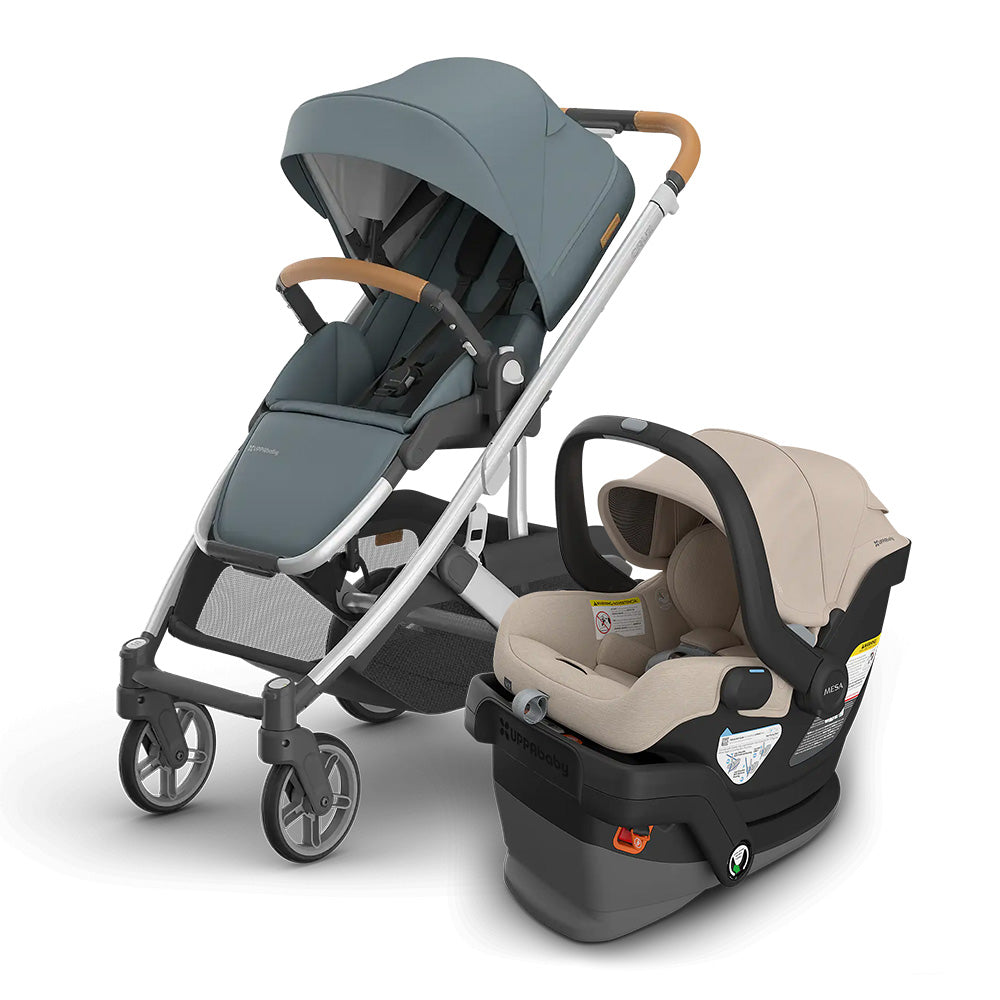UPPAbaby Cruz V3 Stroller + Mesa V3 Infant Car Seat Travel System, blue-gray stroller with beige car seat ready for a stroll.