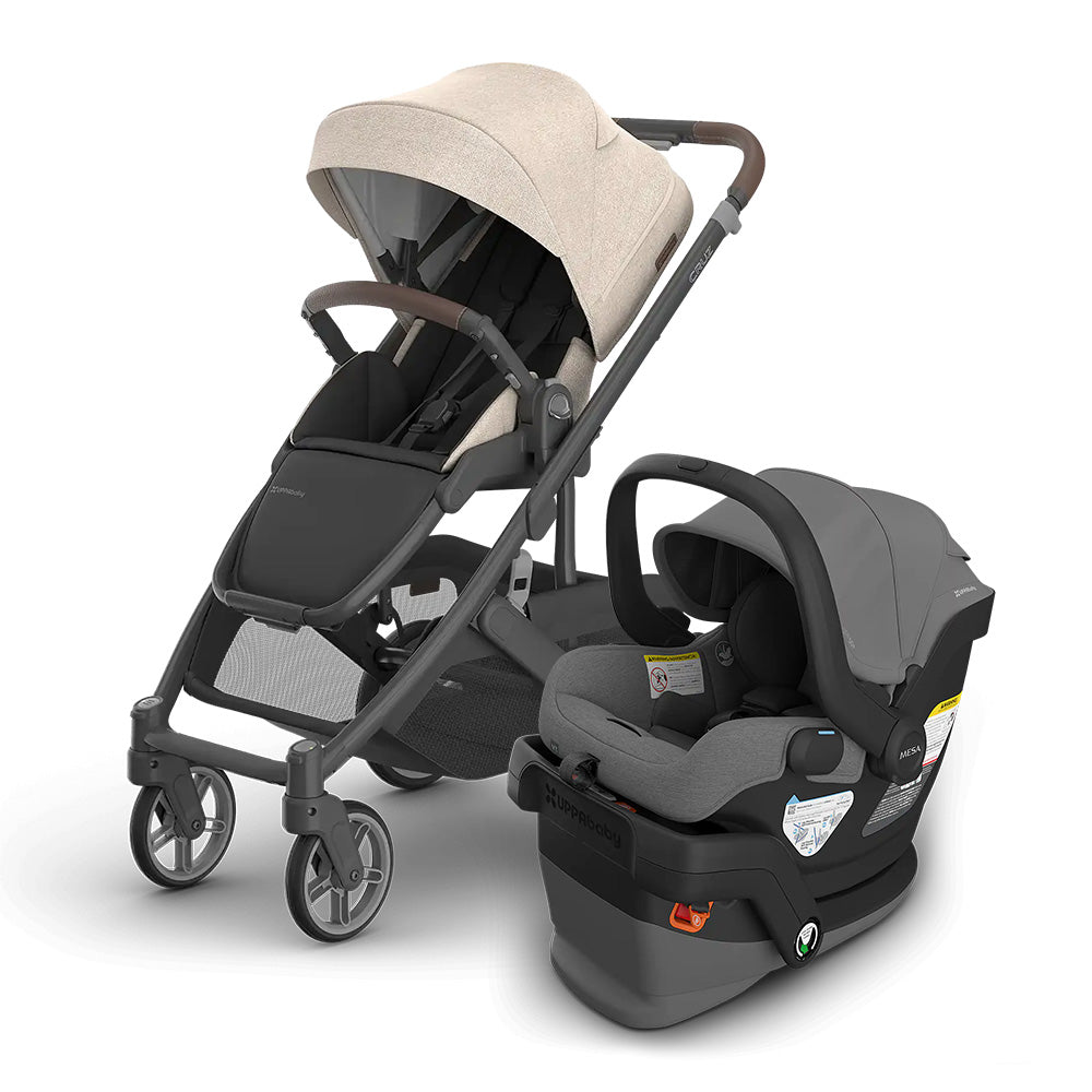 UPPABABY Cruz V3 Stroller and Mesa V3 Infant Car Seat Travel System in beige/grey, car seat attached beside stroller.