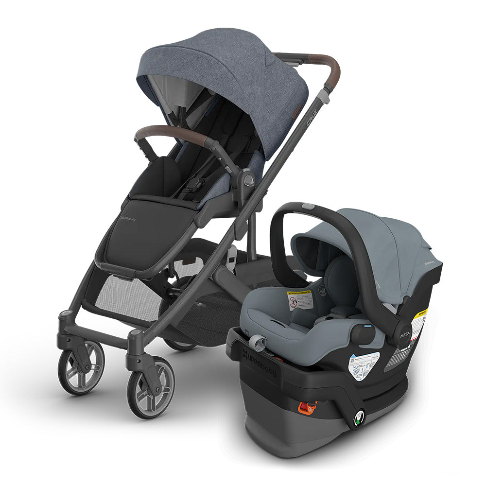 UPPABABY Cruz V3 Stroller + Mesa V3 Infant Car Seat Travel System in blue-gray, car seat attached beside stroller.