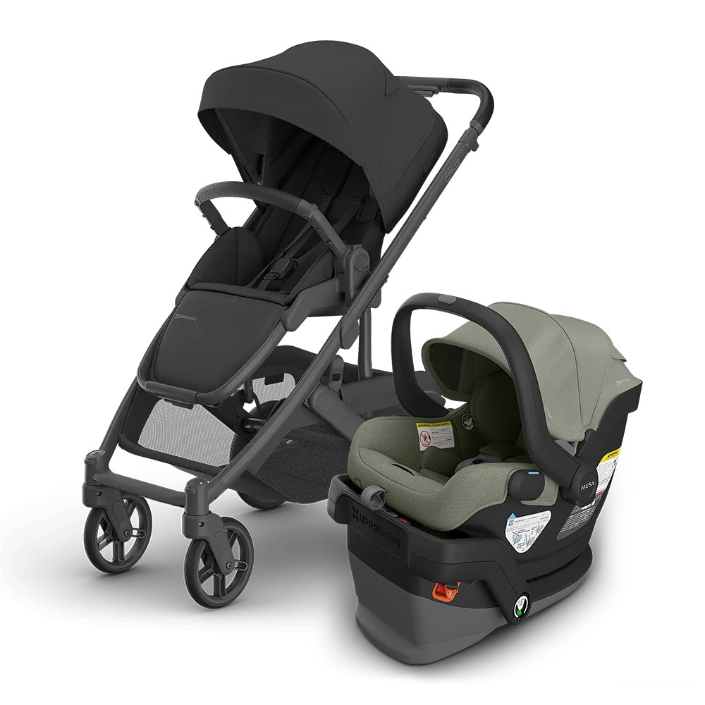 Uppababy Cruz V3 Stroller + Mesa V3 Infant Car Seat Travel System in charcoal gray and sage, with car seat attached to the stroller.