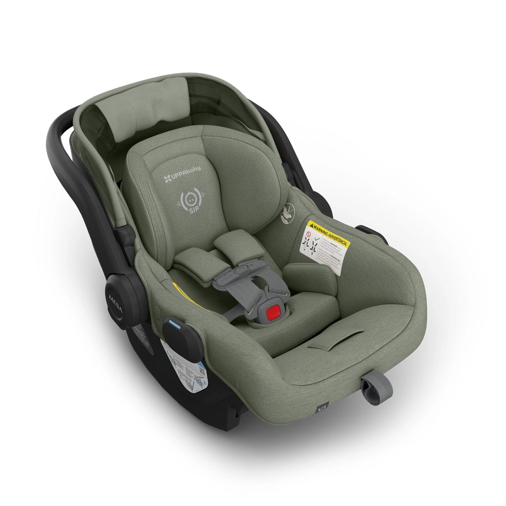 UPPABABY Mesa V3 Infant Car Seat in sage green with five-point harness and carry handle.