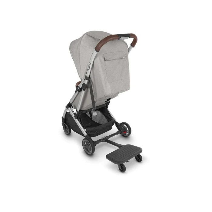 UPPABABY Minu PiggyBack ride-along board on gray stroller with brown handle.