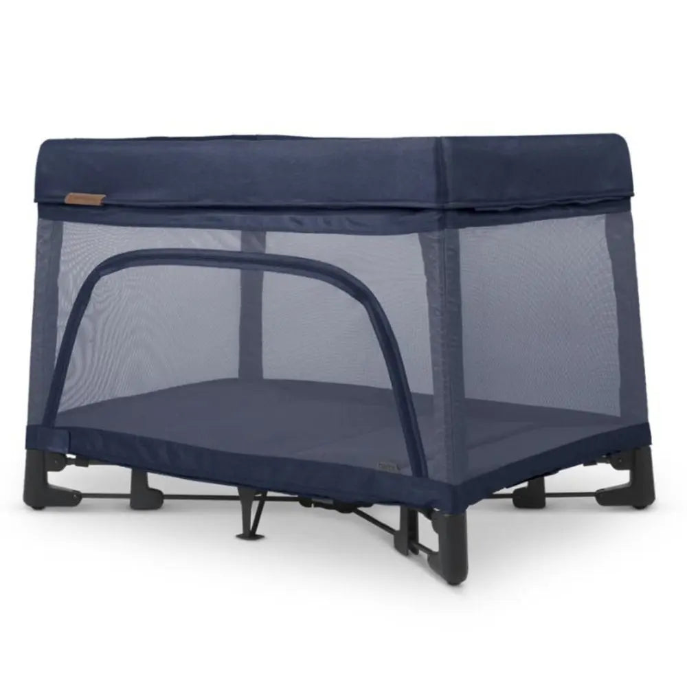 Uppababy Remi Playard navy blue with mesh sides; an arched zipper door is ready for easy access.