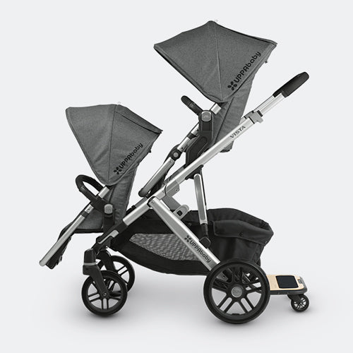 UPPABABY Vista Piggyback Ride-Along Board attached to gray stroller with dual canopies.