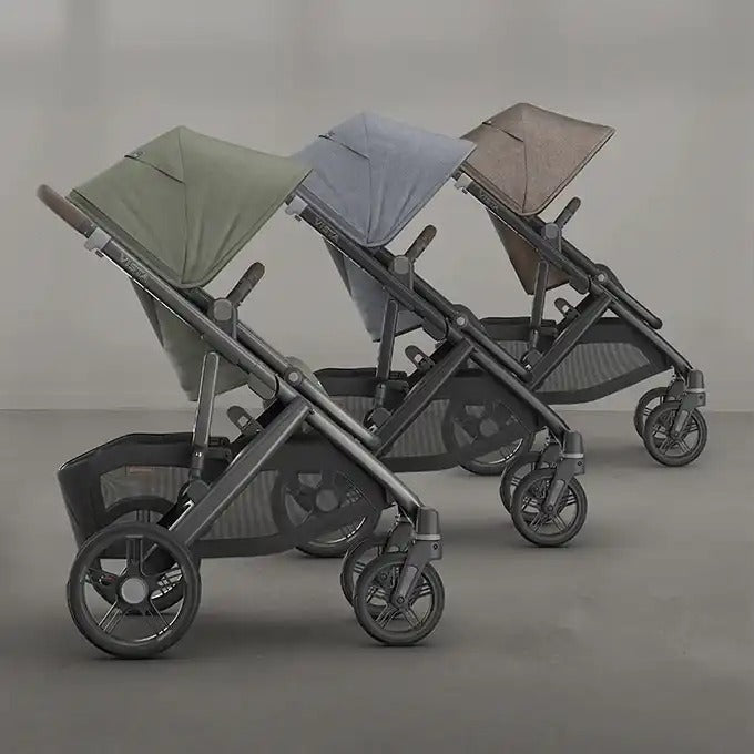 Uppababy Vista V3 stroller trio in green, blue, and taupe canopies with dark frames and wheels