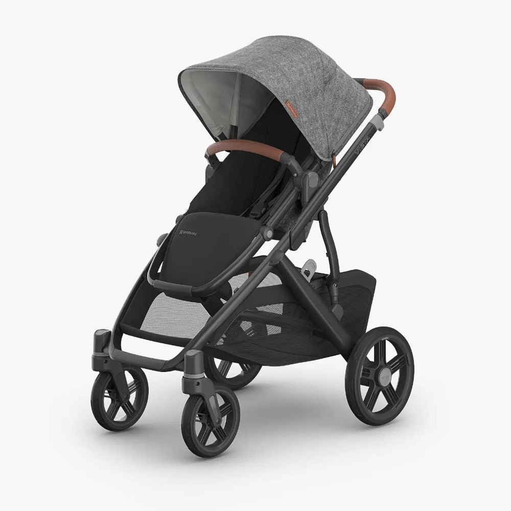 Uppababy Vista V3 Stroller in grey canopy with brown leatherette handle and black frame, ready for a family stroll.
