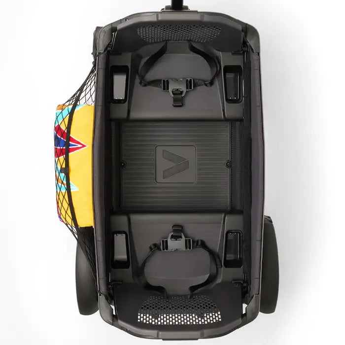 Veer Cargo Net stroller accessory with a colorful bag secured on the left side, top-down view.