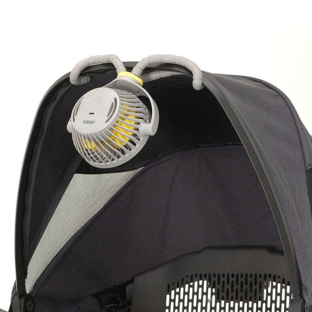 Veer Flex Fan mounted on a stroller canopy; gray housing with yellow blades, VEER.