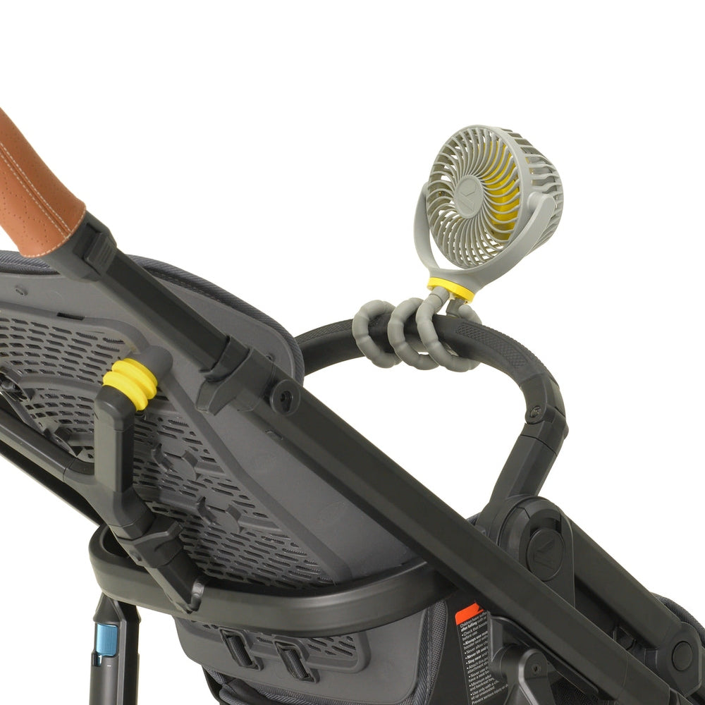 Veer Flex Fan by VEER on a stroller frame; gray and yellow portable fan.