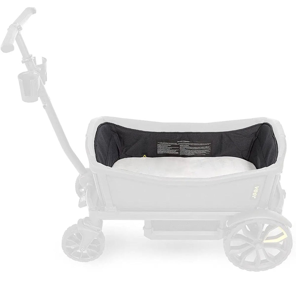 Veer Nap System infant bassinet attachment mounted on a white Veer stroller with black interior.