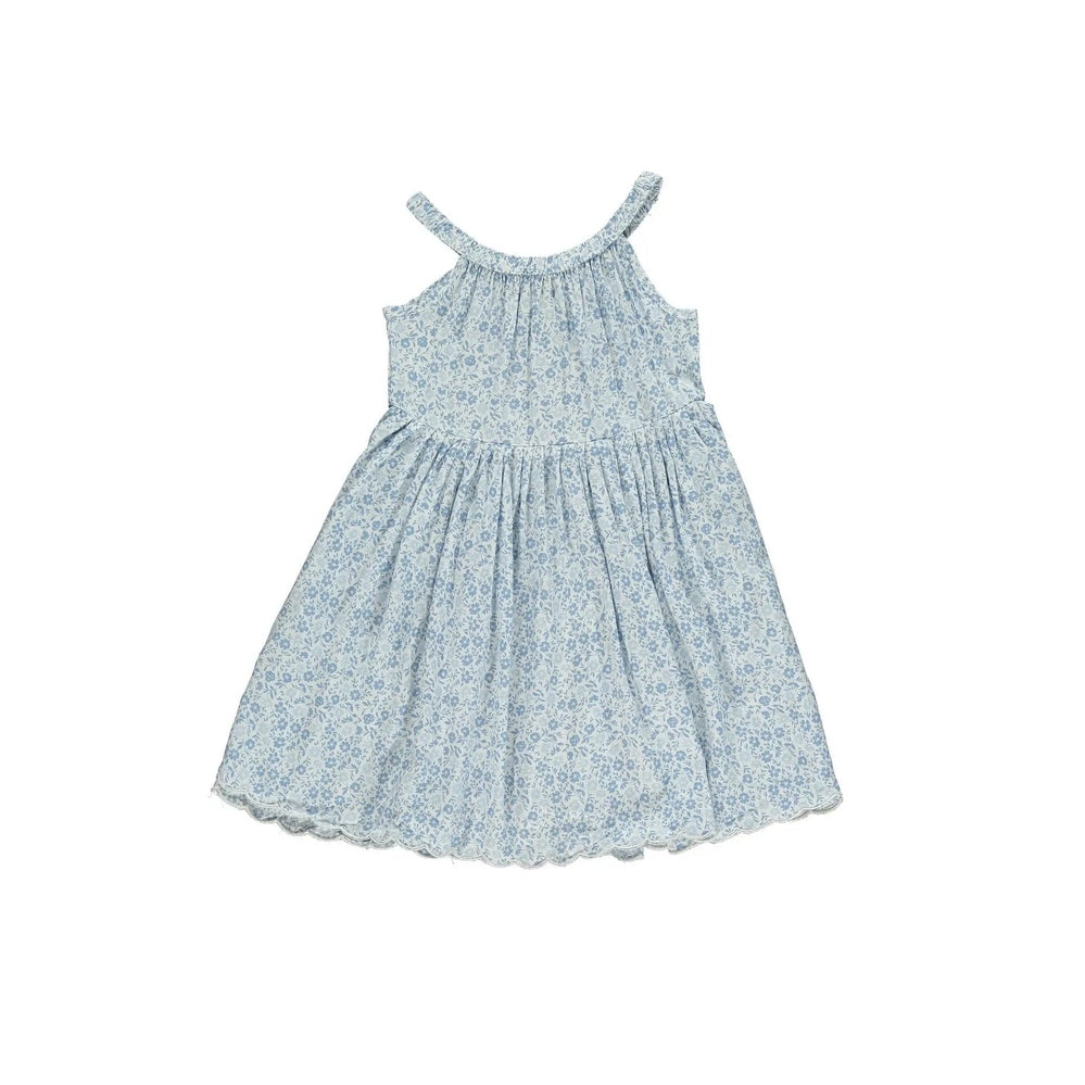 Vignette Stella Dress In Blue Ditsy Floral, sleeveless with tied straps and scalloped hem, airy gathered skirt.