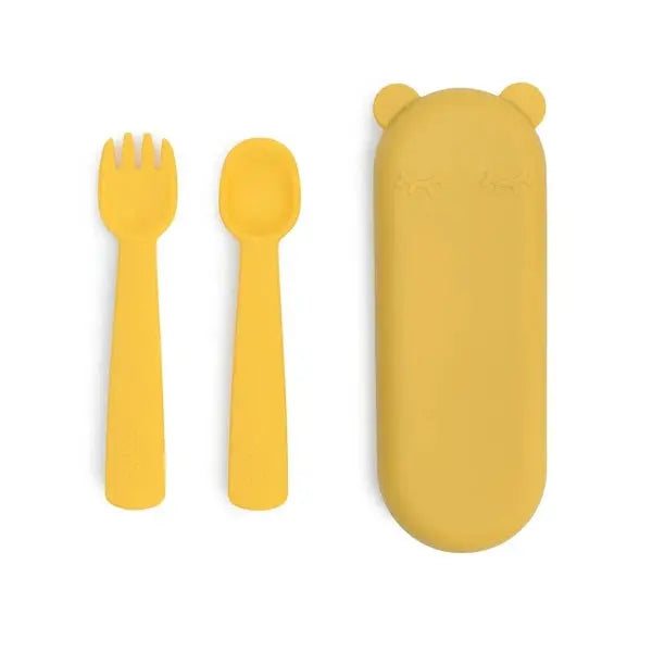 We Might Be Tiny Feedie Fork & Spoon Set in yellow silicone, shown with the matching yellow travel case.