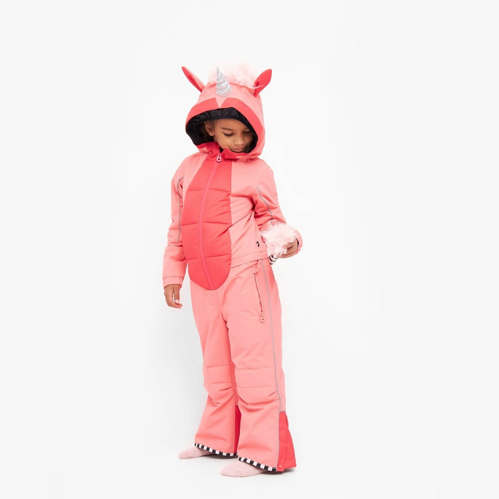 Weedo Silver Unido Unicorn Snowsuit worn by a child in pink with hooded unicorn ears, holding a fluffy pom-pom.