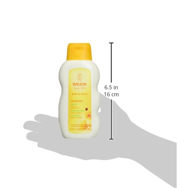 Weleda Comforting Body Lotion 6.8 oz held in a hand, yellow cap and white bottle.