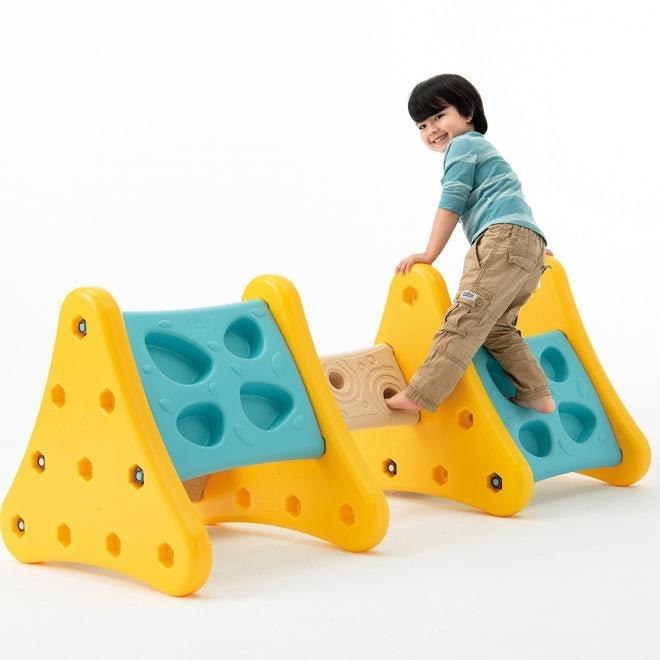 WEPLAY Over The Mountain climbing toy set; yellow arches with teal panels, child climbing across modular units.