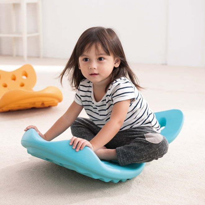 WEPLAY Whally Board blue toddler balance toy; child sits on a blue wobble board.