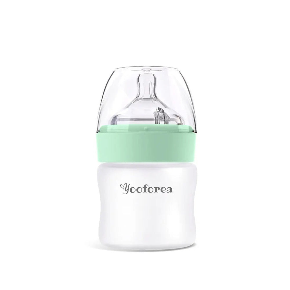 Yooforea silicone-coated glass baby bottle 3oz/90ml with mint green cap shown upright.