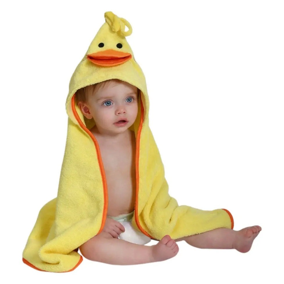 Zoocchini Baby Towel with duck hood, plush terry fabric, baby sits wrapped in cozy yellow bath towel.