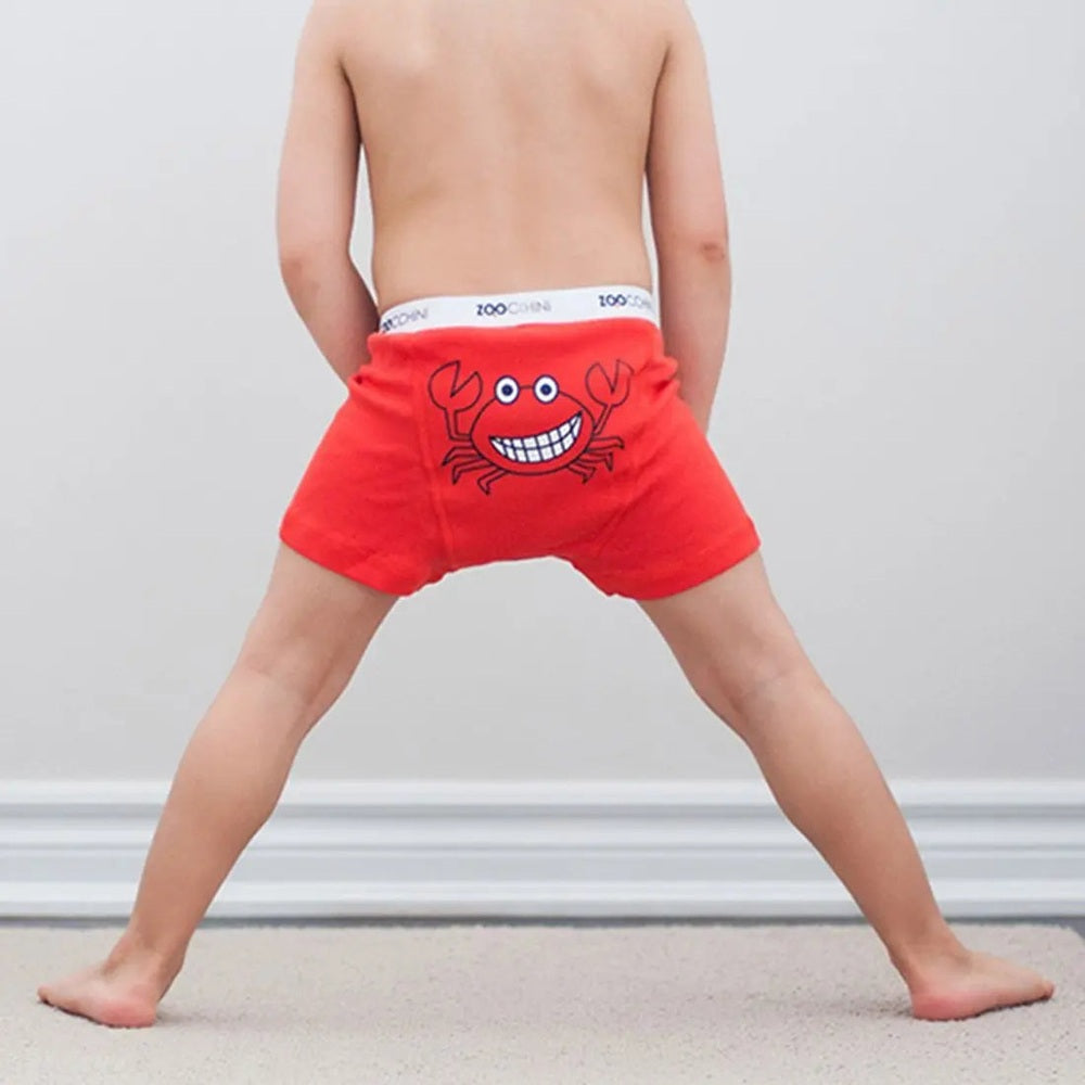 Zoocchini Boys Organic Boxer Chompy Chompers red boxer shorts with white waistband; child stands wide-legged to display crab graphic.