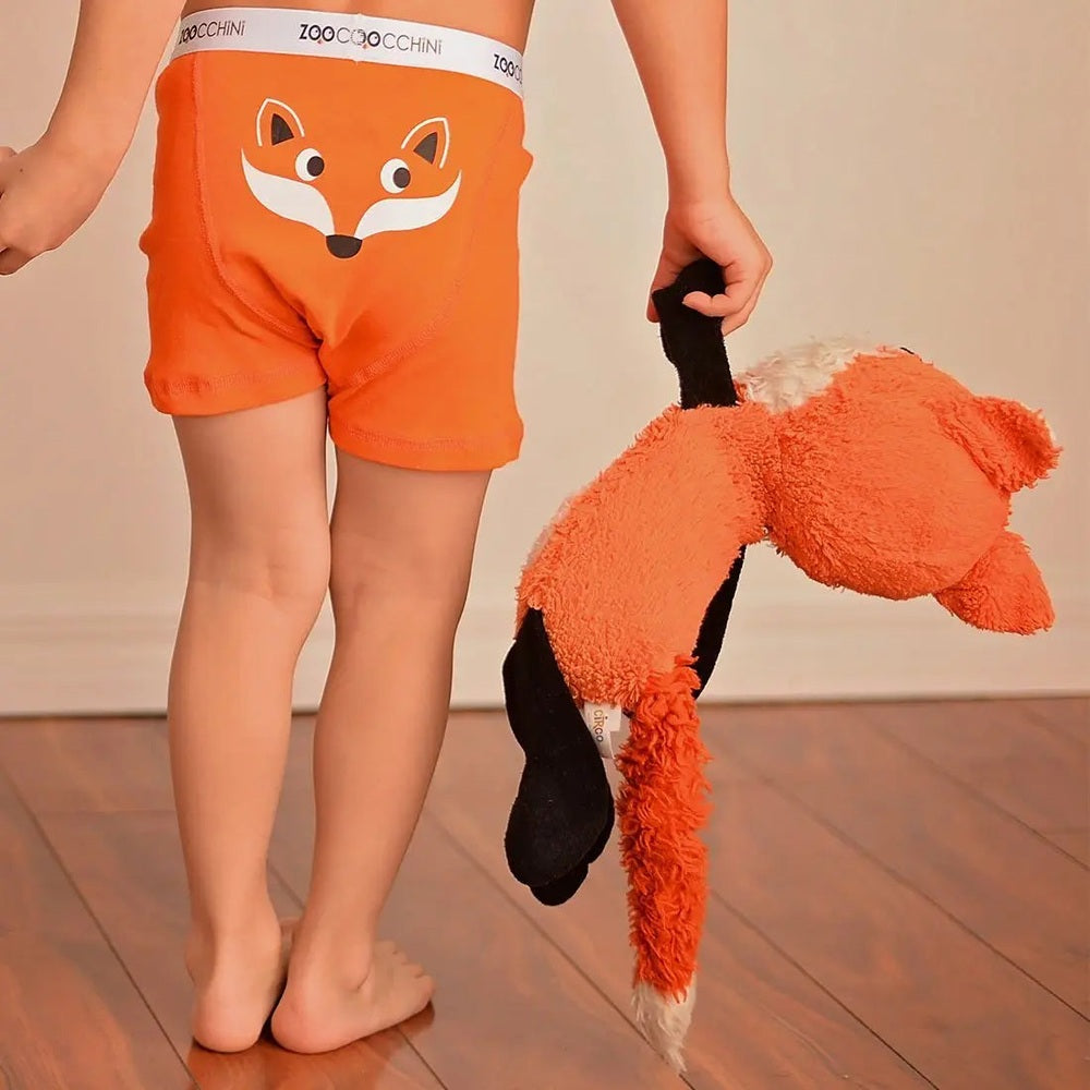 Zoocchini Boys Organic Boxer 3Pk Enchanted Forest; orange boxer shorts with fox graphic, branded waistband, child holds plush fox.