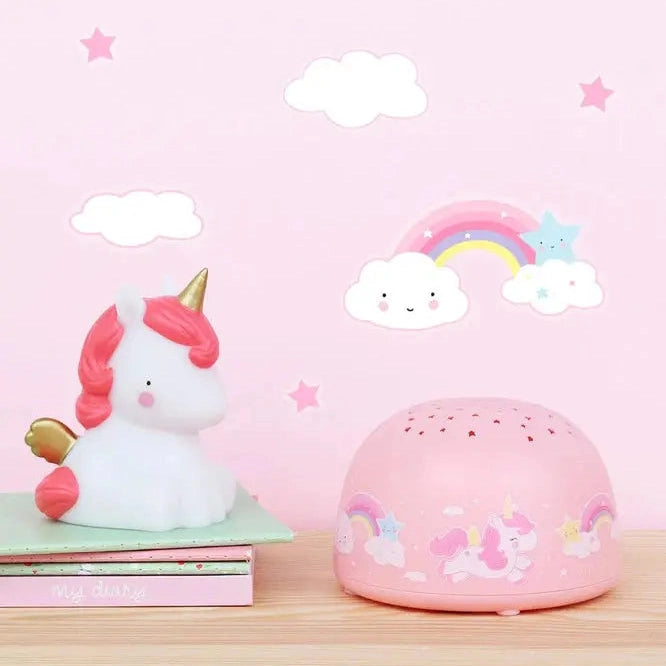 A Little Lovely Company Projector Night Light in pink dome, projecting dreamy unicorns for bedtime.