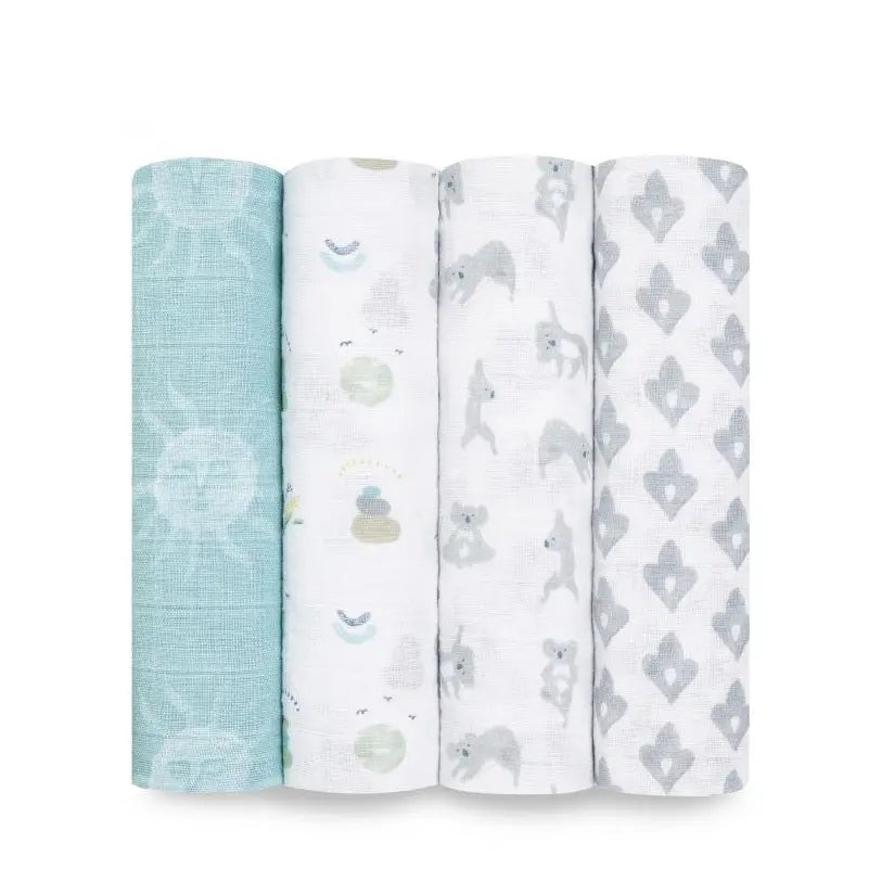 Aden+Anais Classic Swaddles 4Pk in pastel teal/white prints, rolled up ready to wrap a newborn.