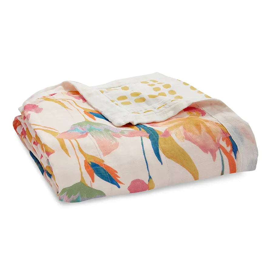 Aden+Anais Silky Soft Dream Blanket folded neatly, showing pastel floral print and lightweight cotton.