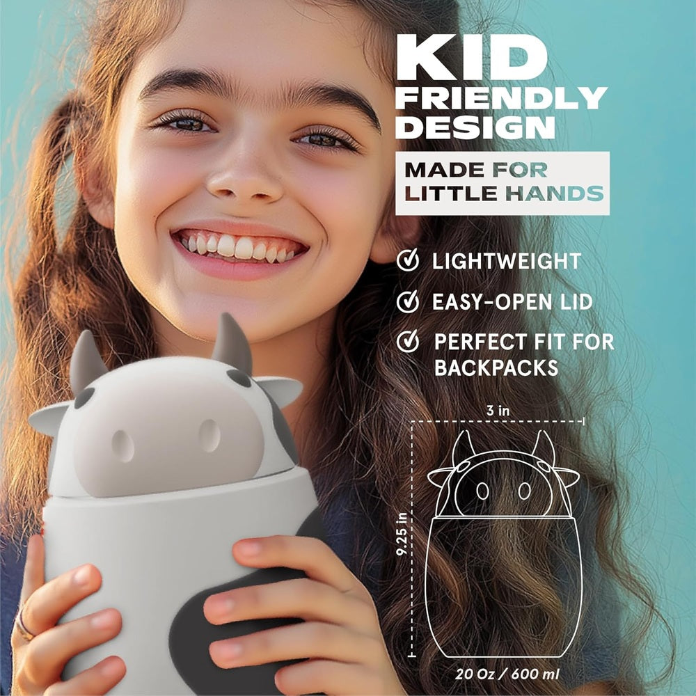 Asobu Foodie Kids Insulated Food Jar 20oz Cow, smiling girl holds the cow-themed thermos securely.