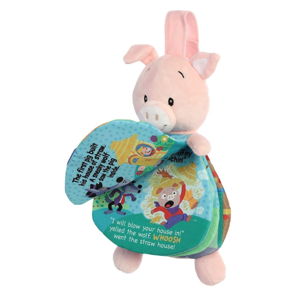 Aurora Ebba Story Pals pig plush with colorful 3 Little Pigs story panel
