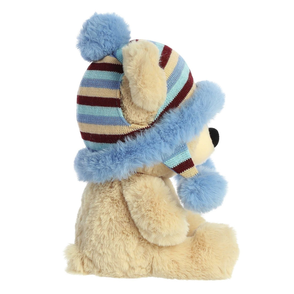 Aurora Bonnie 13-inch holiday bear plush wearing a striped blue beige hat with blue pom-poms