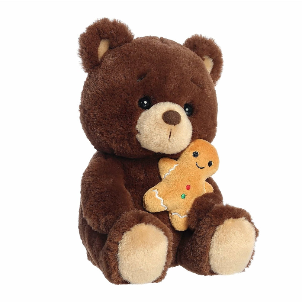 Aurora Holiday Barista Bear Gingerbread Man 10" plush toy, a soft brown bear holding a smiling orange gingerbread cookie.