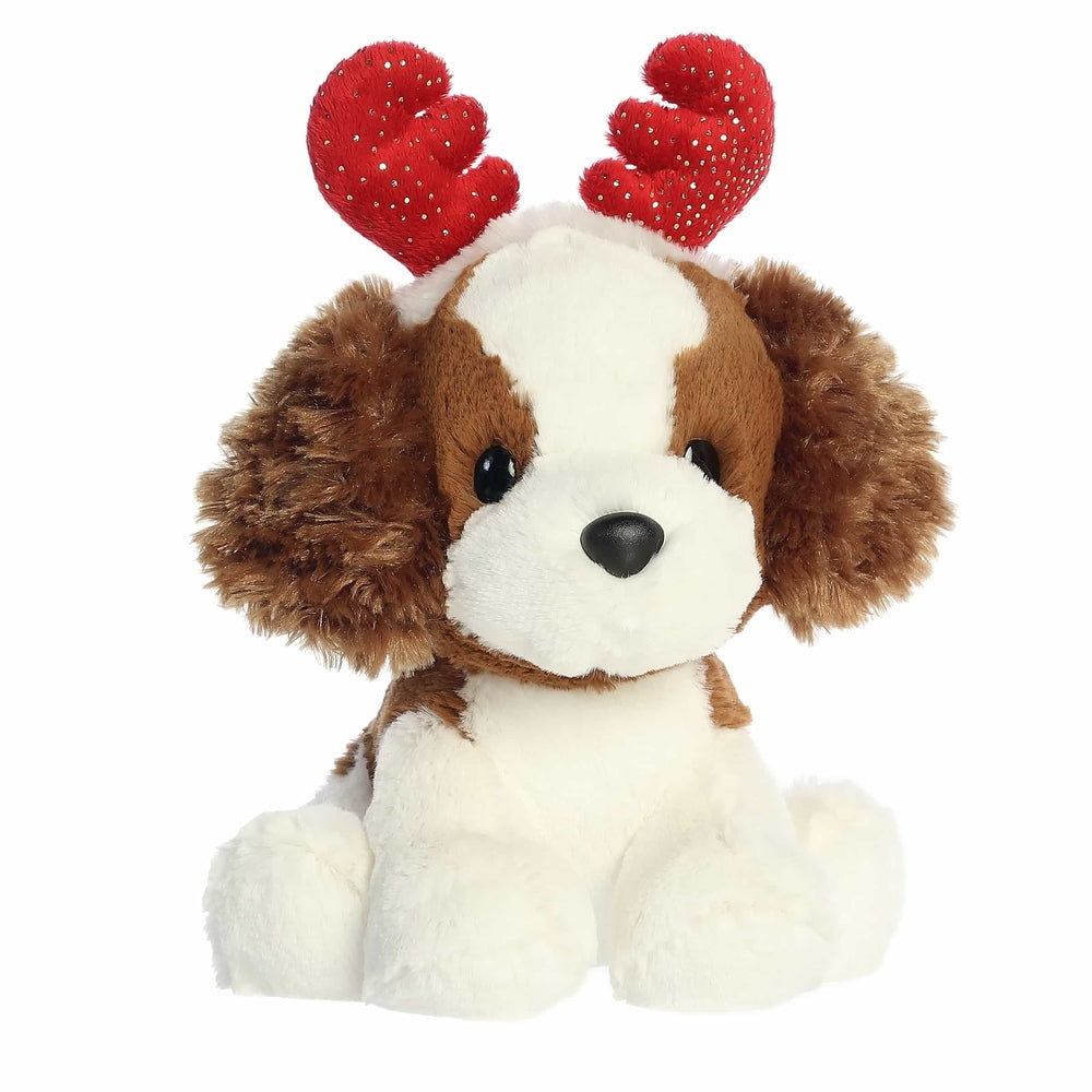 Brown-and-white plush spaniel stuffed animal with red sequined antlers.