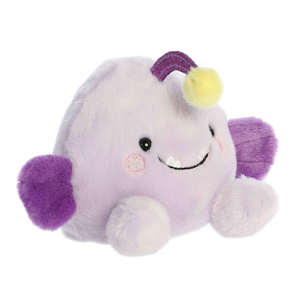 Plush Aurora Palm Pals Blinky Angler Fish, lavender body with purple fins and yellow-tipped antenna.