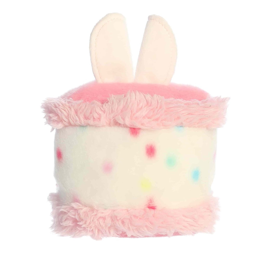 Aurora Palm Pals Bubbi Bunny Cake plush, white with pink frosting trim and pastel sprinkles, 5"