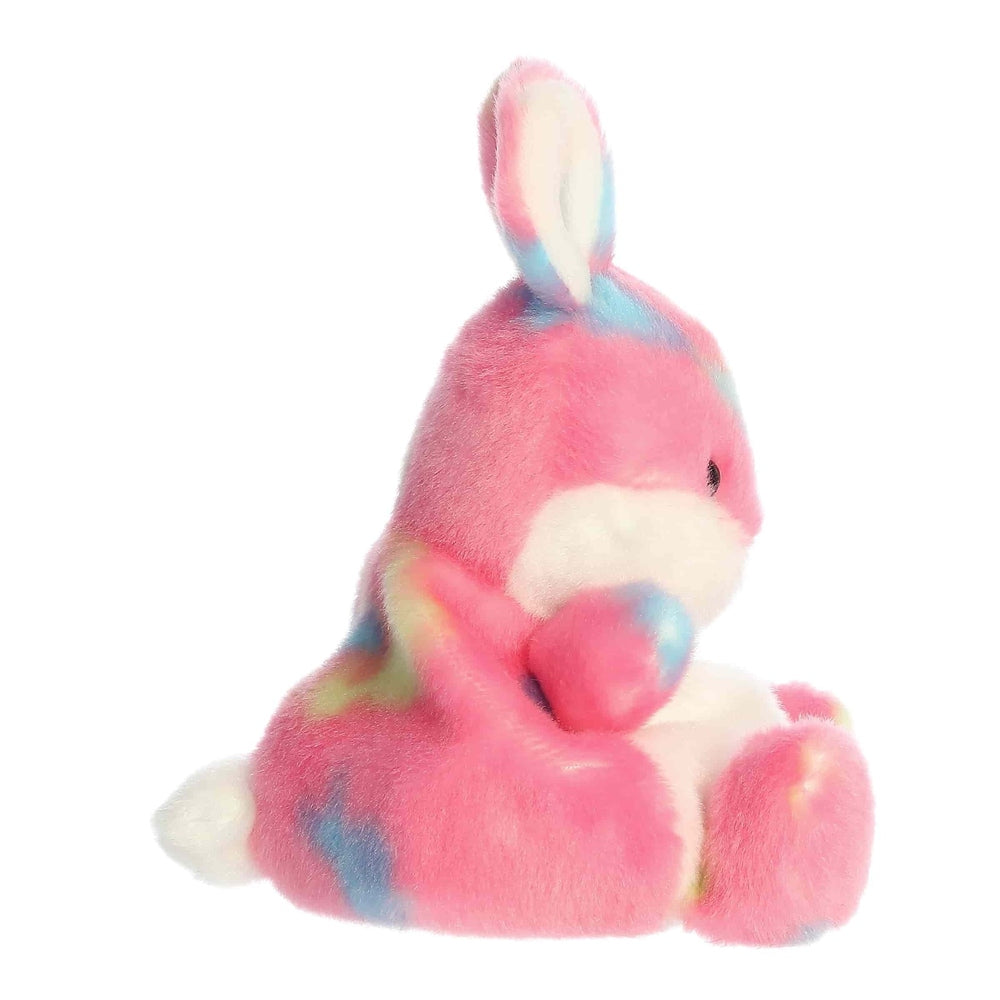 Aurora Palm Pals Jellybean Bunny plush toy in pink with pastel rainbow patches, soft plush.