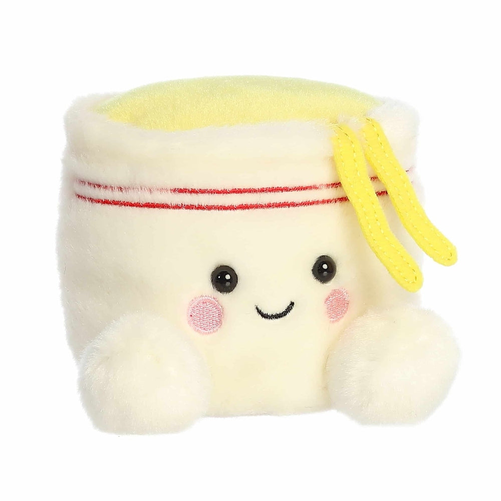Aurora Palm Pals Dashi Cup Noodles plush toy, 5-inch cream cup with yellow lid and red stripe