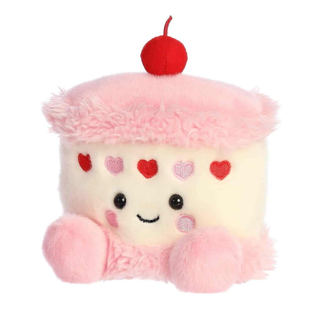 Aurora Palm Pals Jubi Heart Cake 5in plush toy, soft pink/cream cake with heart embroidery and cherry topper.