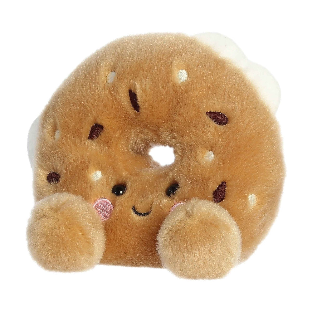 Aurora Palm Pals Tony Everything Bagel plush toy, soft tan bagel with tiny cream sesame seeds and paws