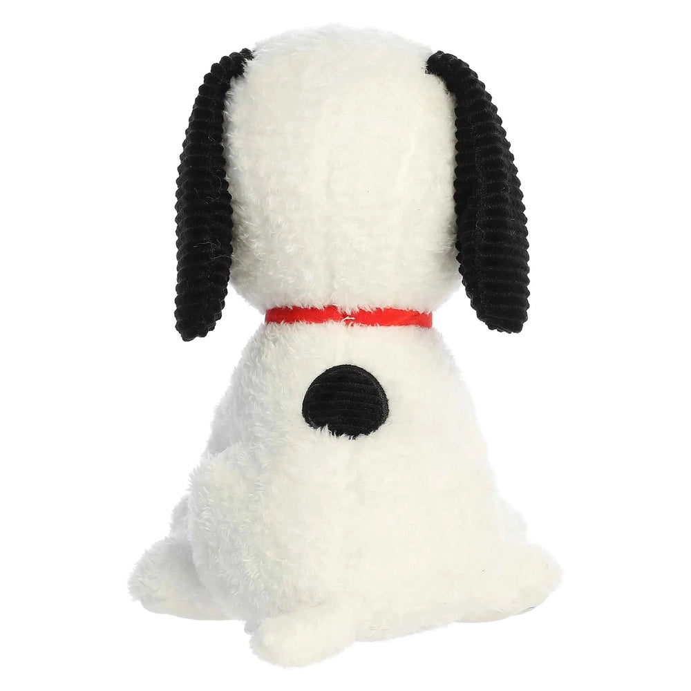 Aurora Peanuts 75th Anniversary Limited Edition Snoopy 10" stuffed toy, white plush with black ears and red collar, calmly seated.