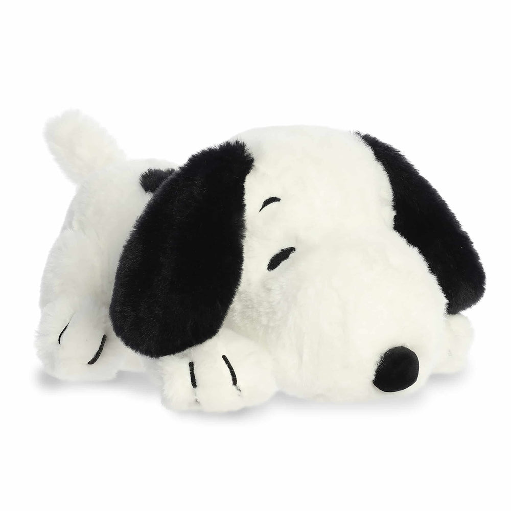 Aurora Peanuts Snoopy 12-inch plush dog, white body with black ears, lying down stuffed animal