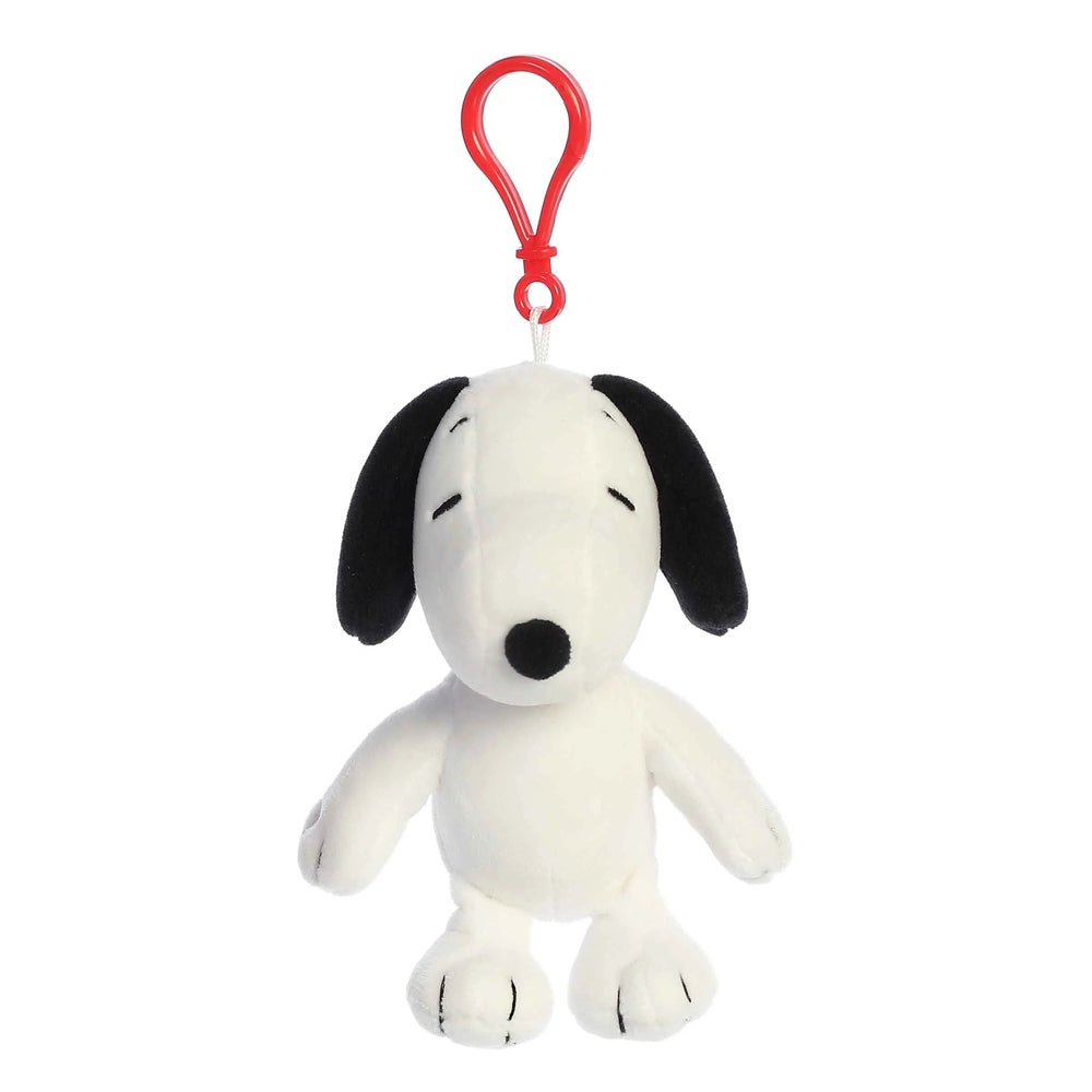 Snoopy clip-on plush toy by Aurora, white body with black ears and red clip loop.