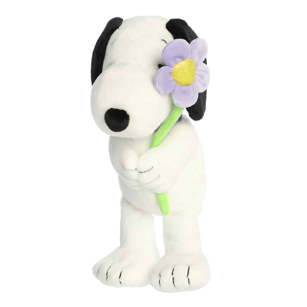 Aurora Snoopy 11-inch plush stuffed animal, white with black ears, holding a purple flower