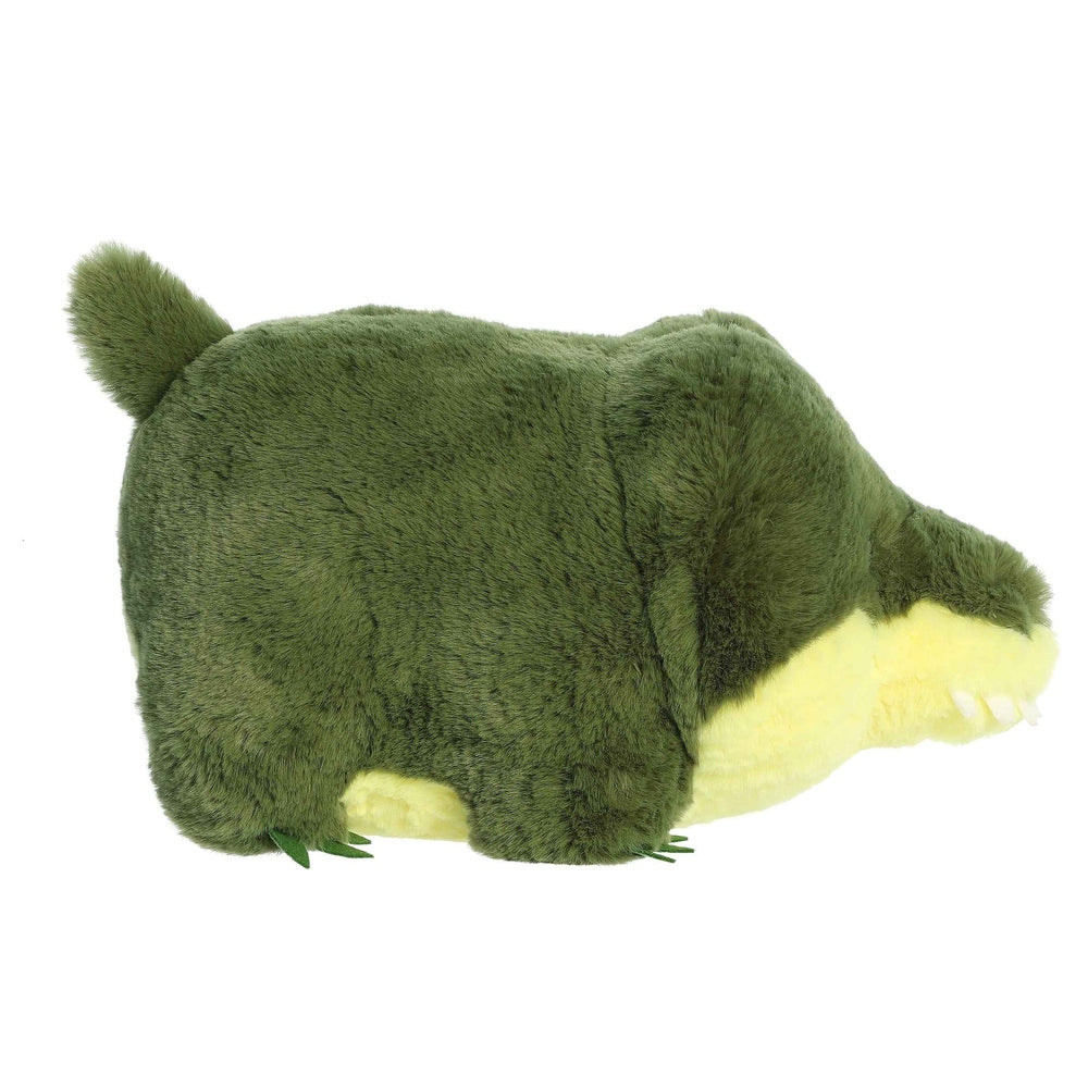 Aurora Spudsters August Alligator 10" plush toy in green with yellow belly, lounging on its side.