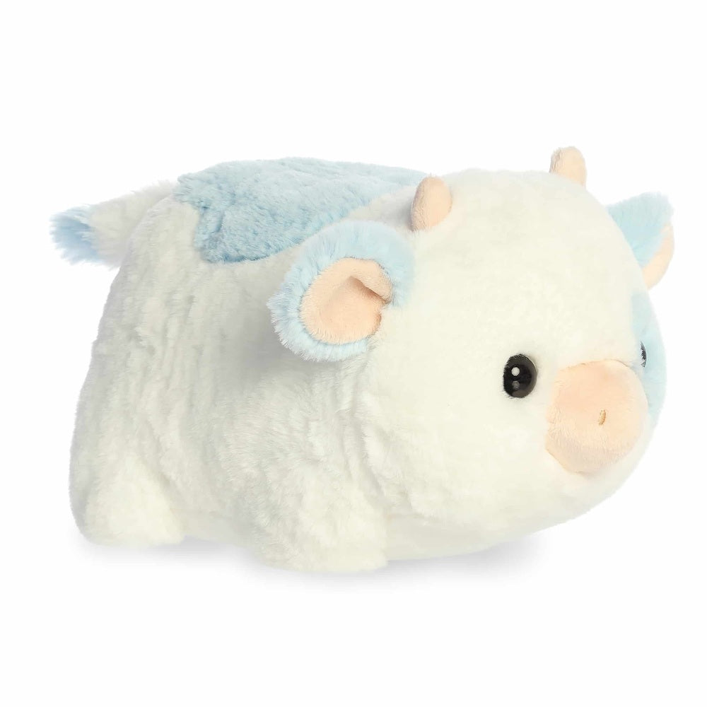 Aurora Spudsters Bonnie Blueberry Cow plush lying on its side with blue patches and cream fur.