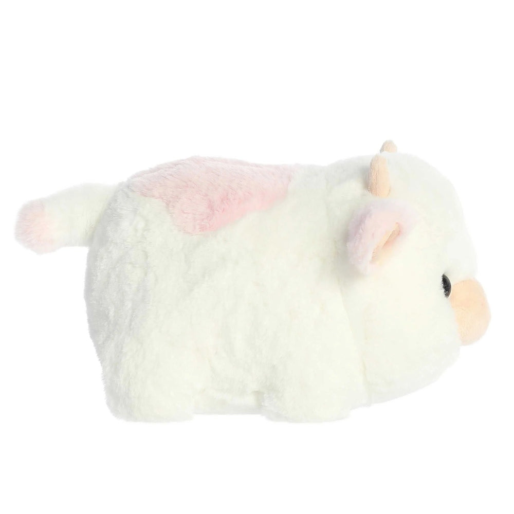 10-inch plush white cow with pastel pink patch, pink inner ears, cream horns, peach nose, fluffy fur and pink-tipped tail.