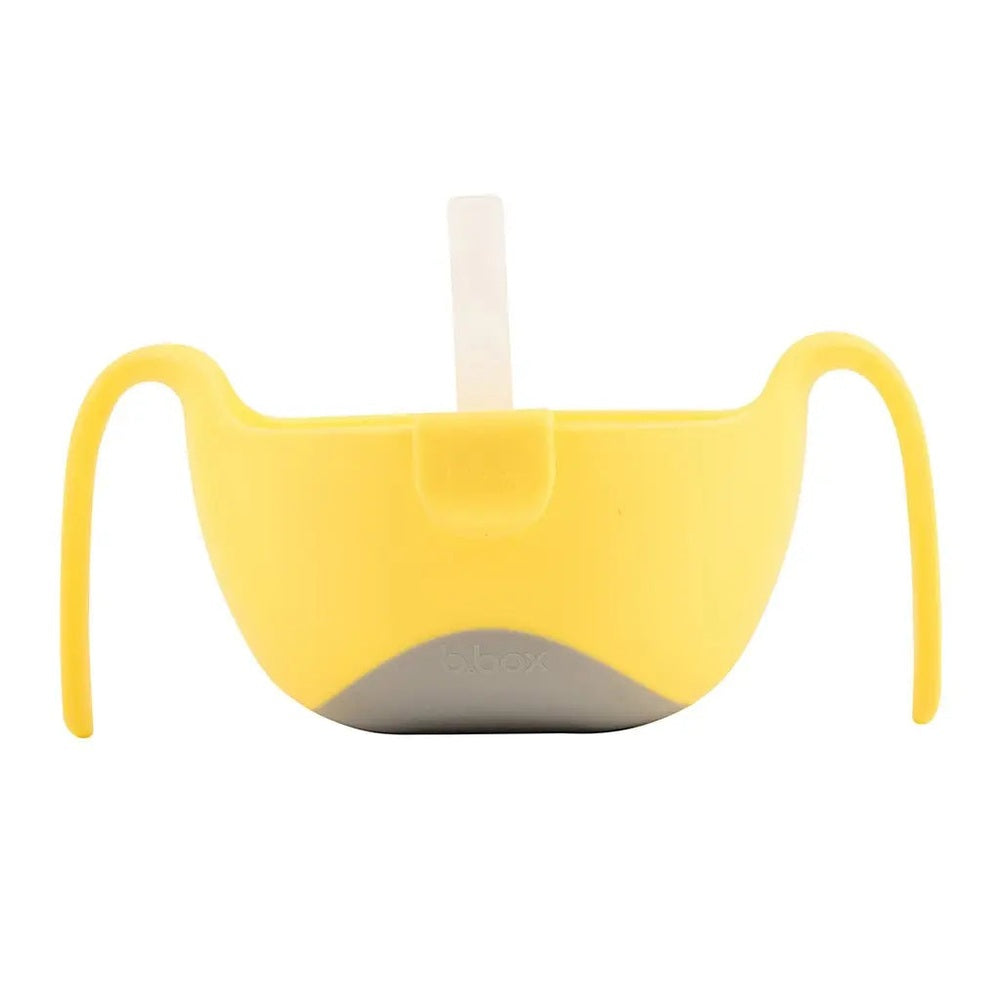 B.Box Bowl XL with yellow handles and built-in straw, shown ready for toddler sipping.