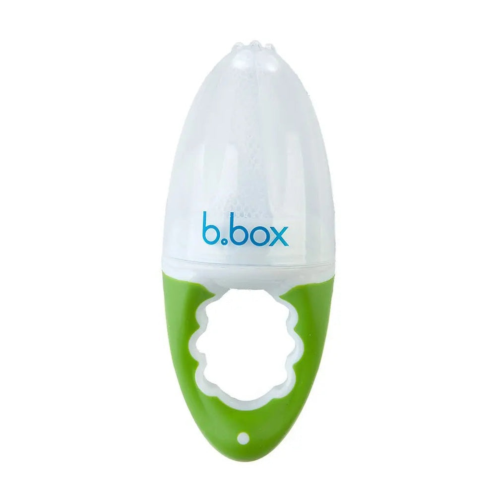 B.Box Fresh Food Feeder in white with lime green handle, showing a baby-friendly grip for safe feeding